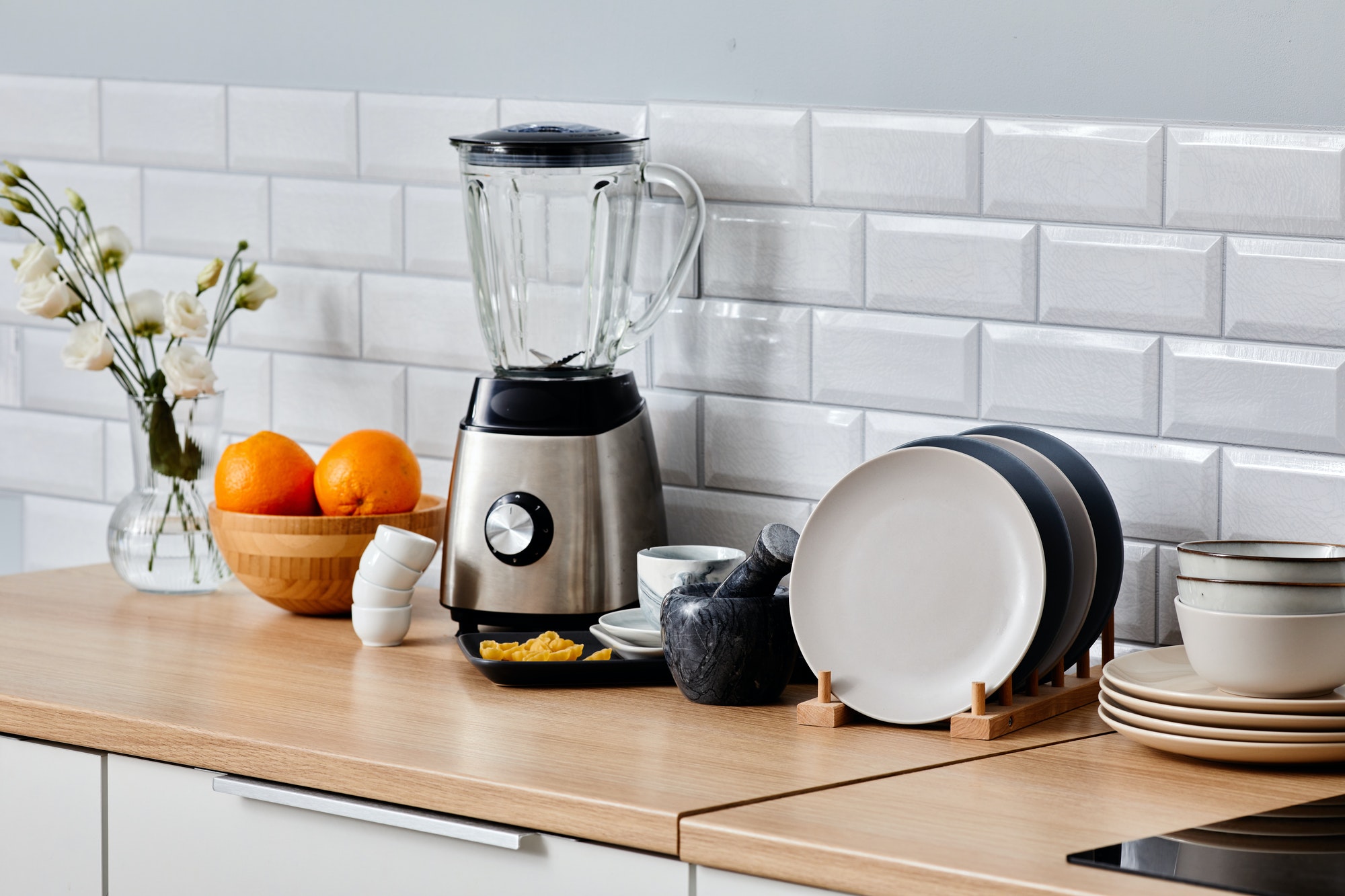 Kitchen appliance with crockery on table